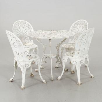 A SET OF FOUR GARDEN CHAIRS AND A GARDEN TABLE, second half of 20th century.