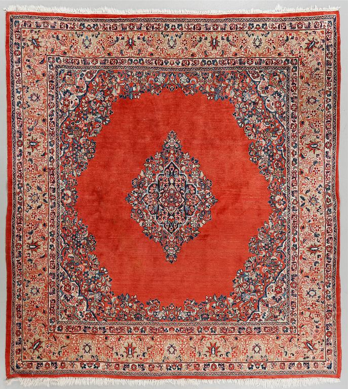 A Kirman rug, old, 218 x 210 cm.