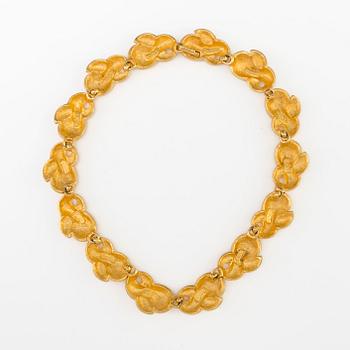 a necklace by Fendi.