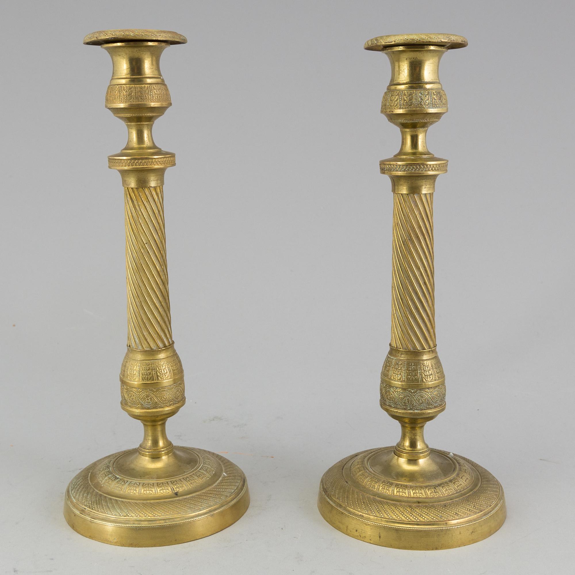 A pair of 'Empire' candlesticks, probably French.