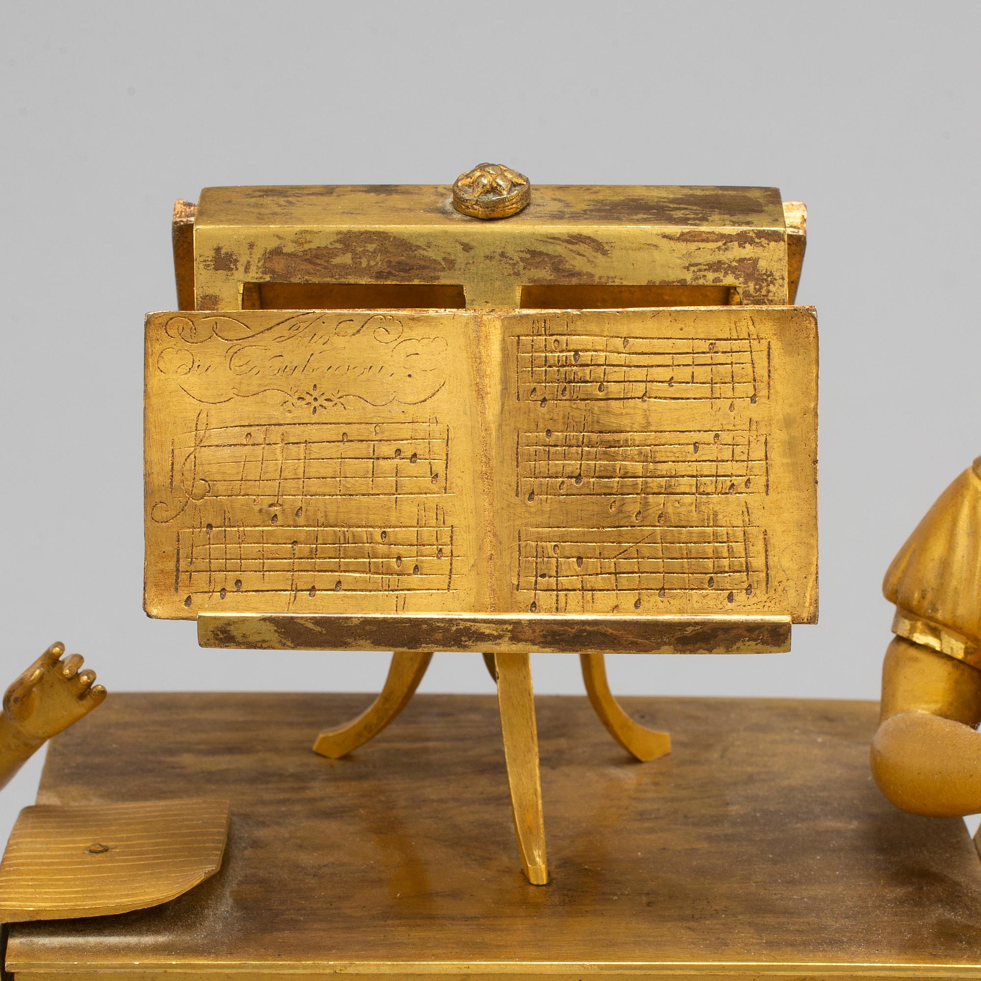 A French Empire gilt bronze mantel clock, first half of the 19th century.