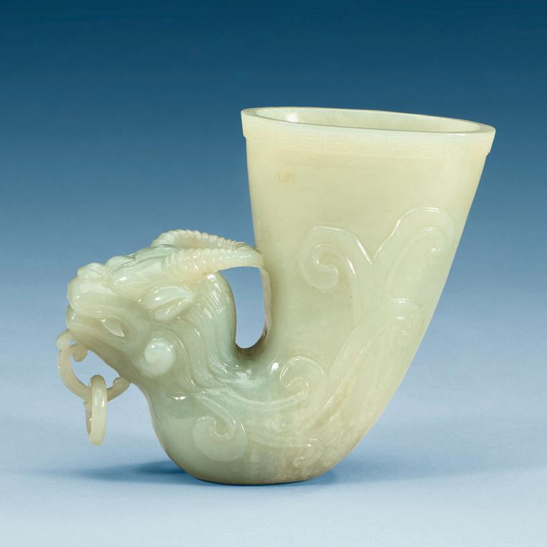 A Chinese carved nephrite rhyton beaker.