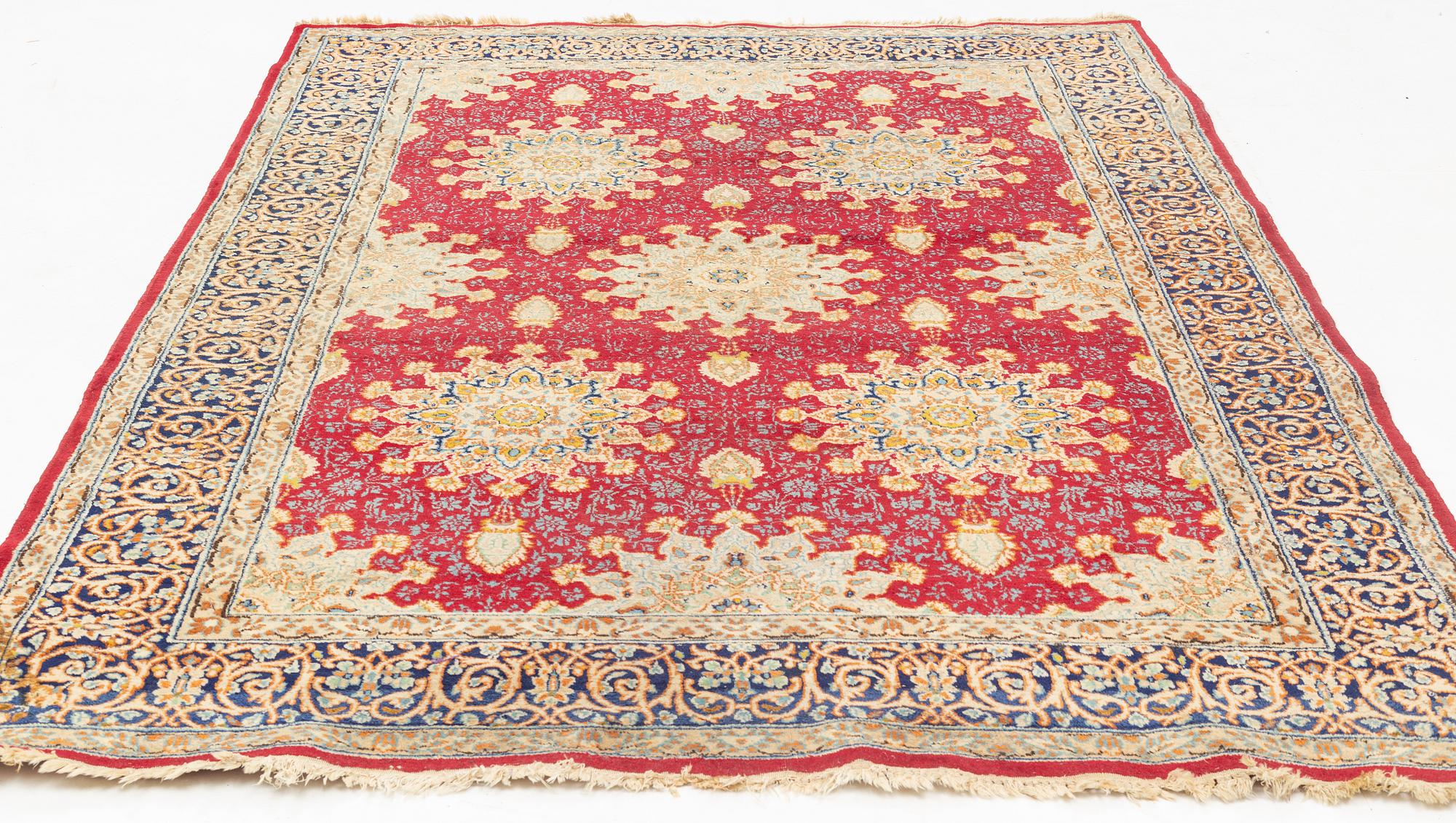 An oriental carpet, c. 290 x 198 cm.