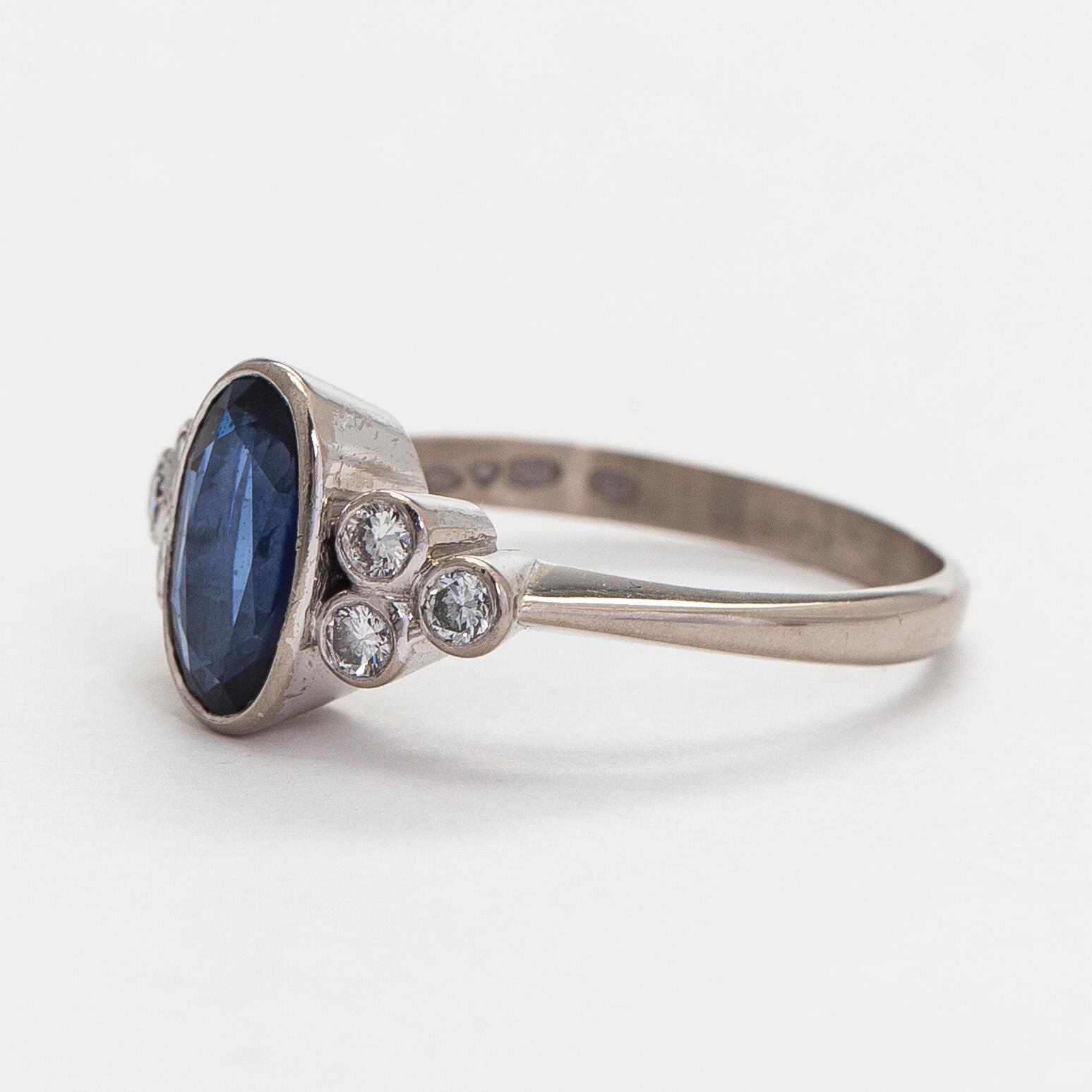A. Tillander, ring, faceted sapphire, brilliant cut diamonds, 18K white gold, Helsinki 1983.