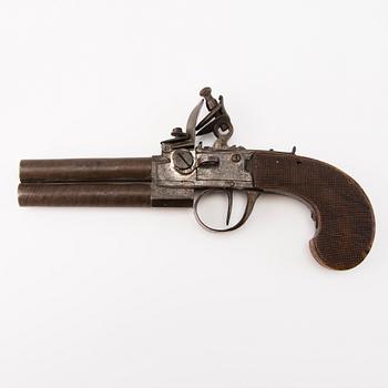 A late 18th Century, probably British double-barrelled flintlock pistol.