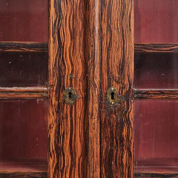 A Swedish faux-boix neo-gothic book cabinet, ca 1830.