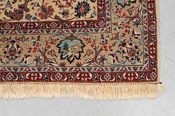 A carpet, semi-antique Tabriz, figural, signed, ca 234 x 170 cm.