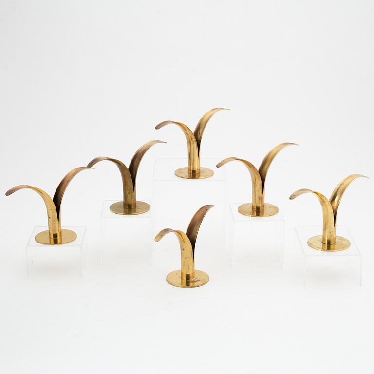 Ivar Ålenius-Björk, a set of six 'Liljan' candlesticks from Ystad Metall, mid 20th Century.