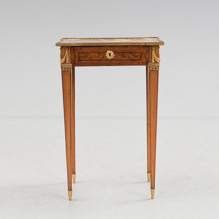 A Louis XVI-style circa 1900 occasional table.
