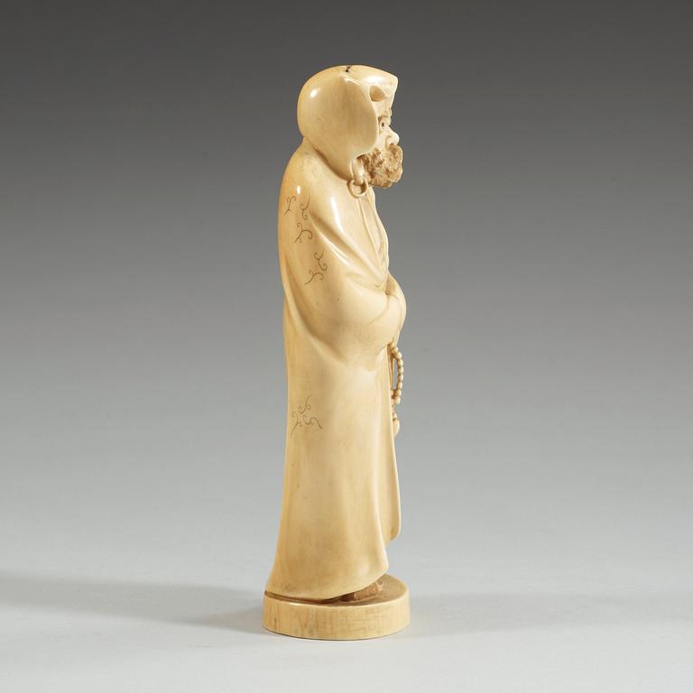 A Japanese ivory figure of a deamon, Meiji period (1868-1912).