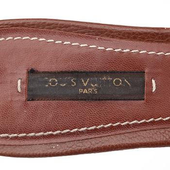 LOUIS VUITTON, a pair of brown leather slip in shoes.
