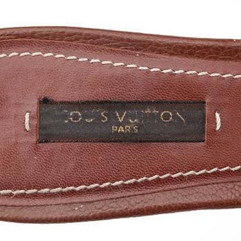 LOUIS VUITTON, a pair of brown leather slip in shoes.