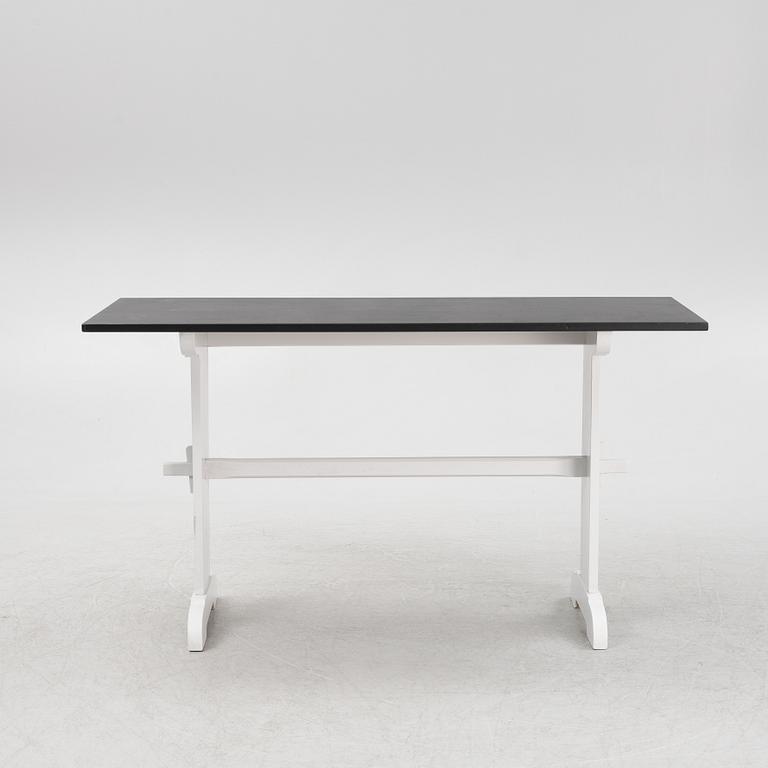 A painted table, 20th Century.