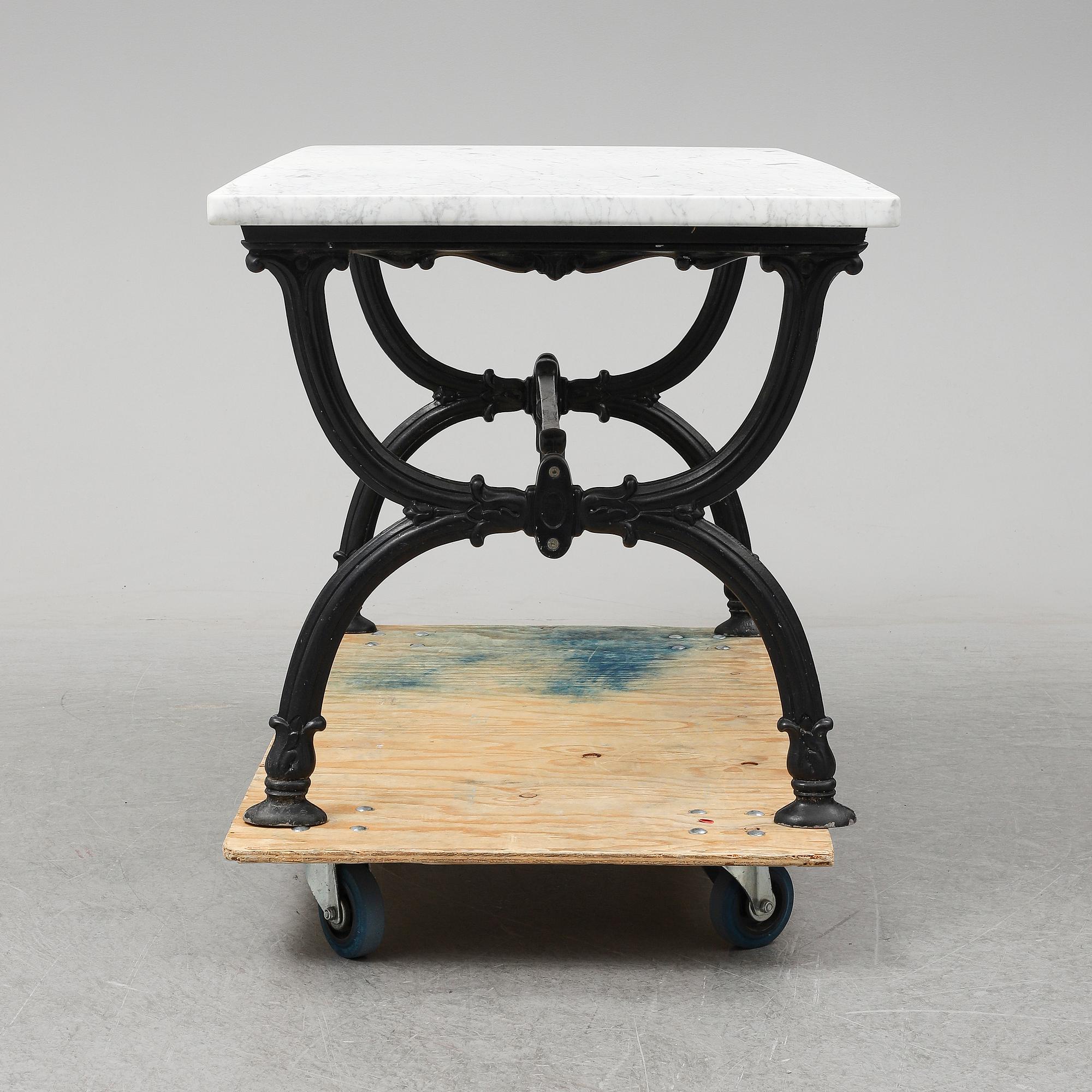 An end of the 20th Century aluminum and marble garden table.