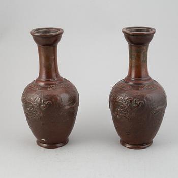 A pair of Japanese copper alloy temple vases, Meiji period (1868-1912).