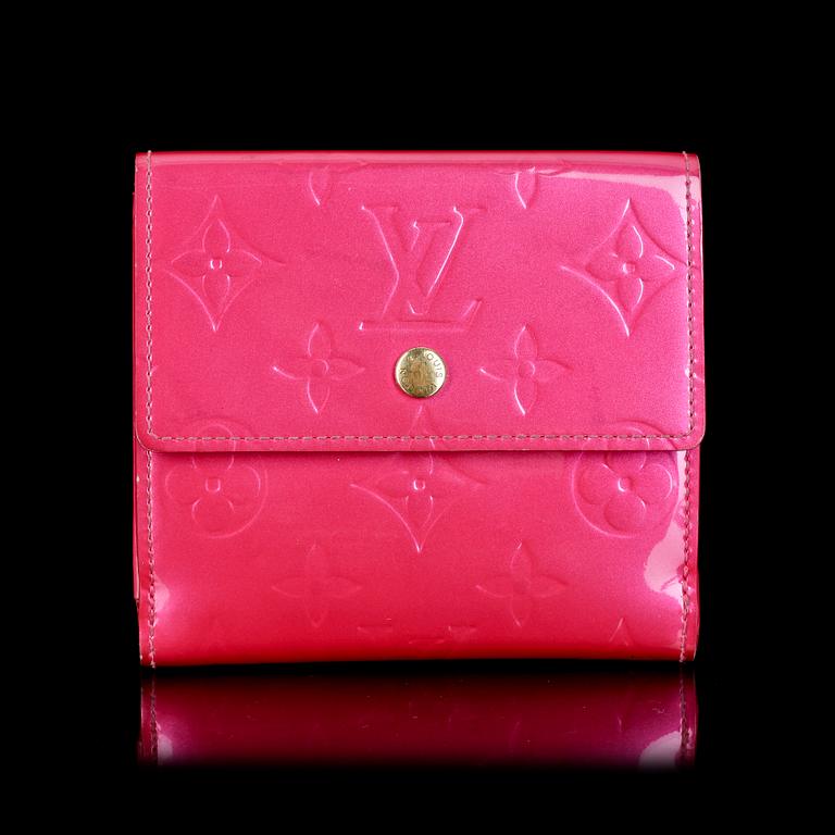 A cerise monogram vernis wallet by Louis Vuitton.