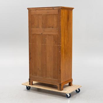 A walnut veneered tall boy dresser, early 20th century.