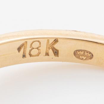 Ring, 18K gold with a synthetic white stone.