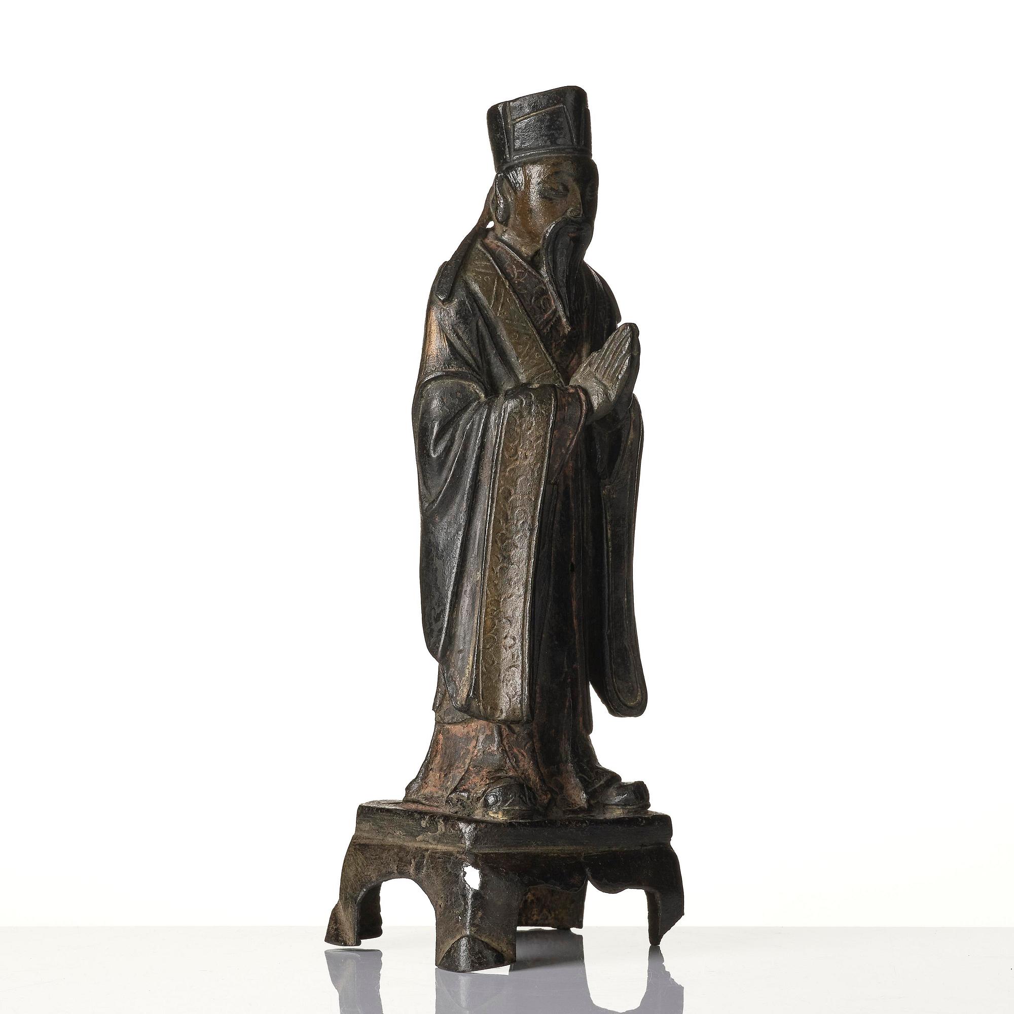 A bronze sculpture of a daoist immortal, Ming dynasty (1368-1644).