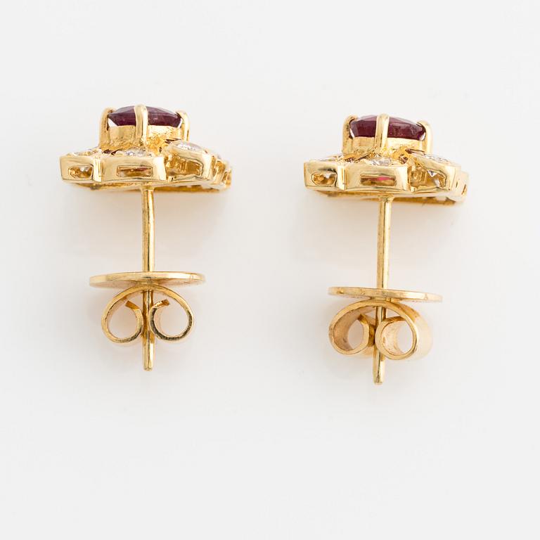 Earrings, gold, with rubies and brilliant-cut diamonds.