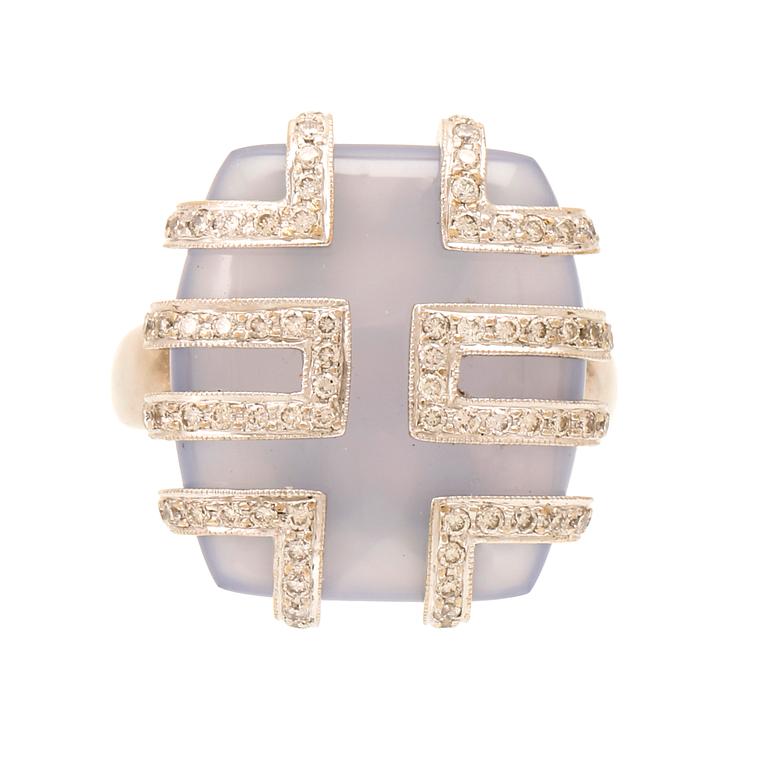 An 18K white gold ring with brilliant cut diamonds and possibly chalcedony.