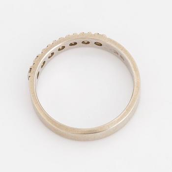 A half-eternity ring set with round, brilliant-cut diamonds.