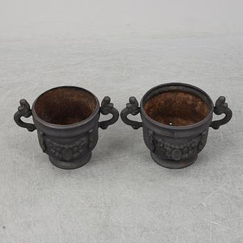 Two 20th Century cast iron flower pots.