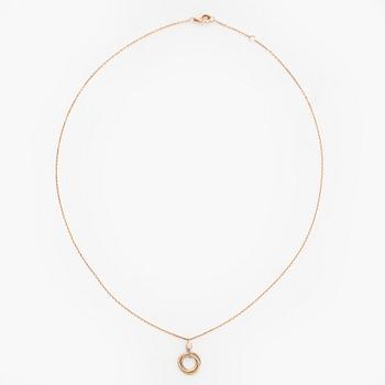 Cartier, an 18K gold 'Trinity Pendant' necklace with a brilliant-cut diamond.