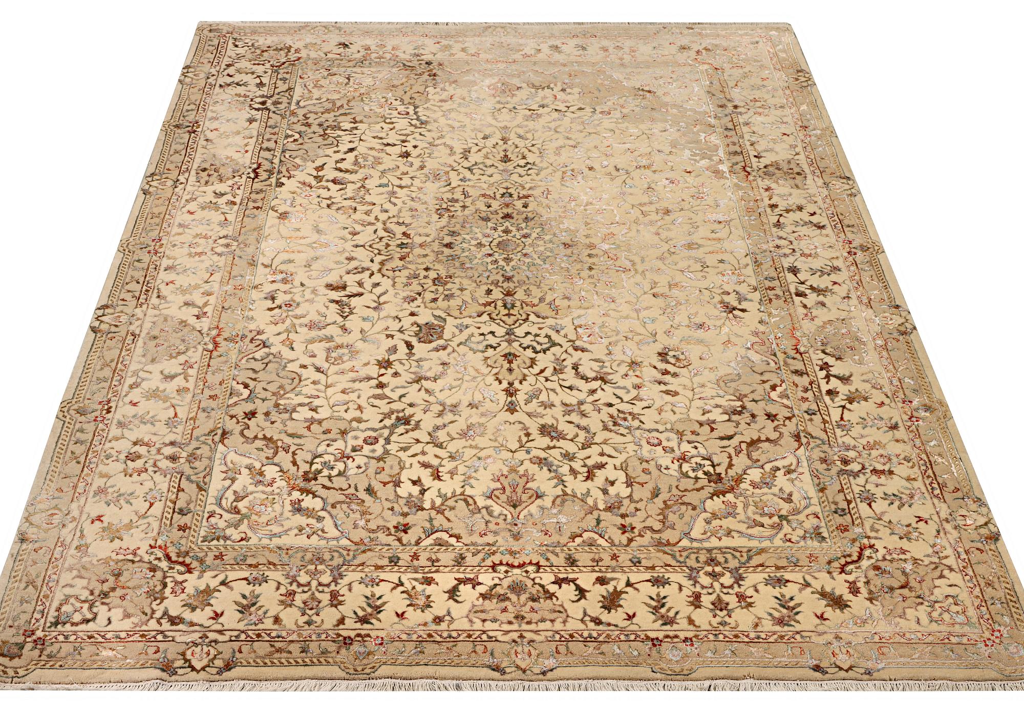 A Tabriz carpet, part silk, c. 311 x 199 cm.