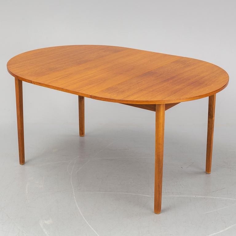 A teak veneered table, second half of the 20th century.
