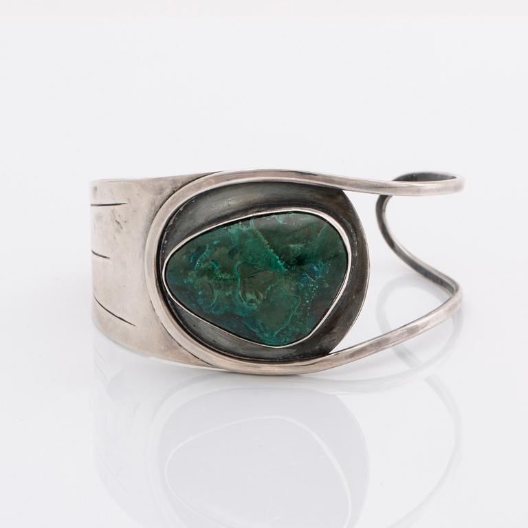 2 silver bracelets, 1 with a green stone, wider bracelet swedish import mark, original invoice dated 1977.