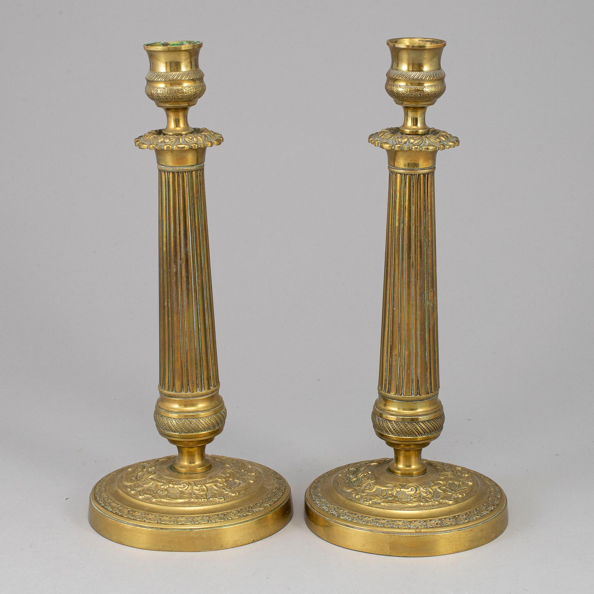 A pair of empire bronze candlesticks, first half of the 19th century.