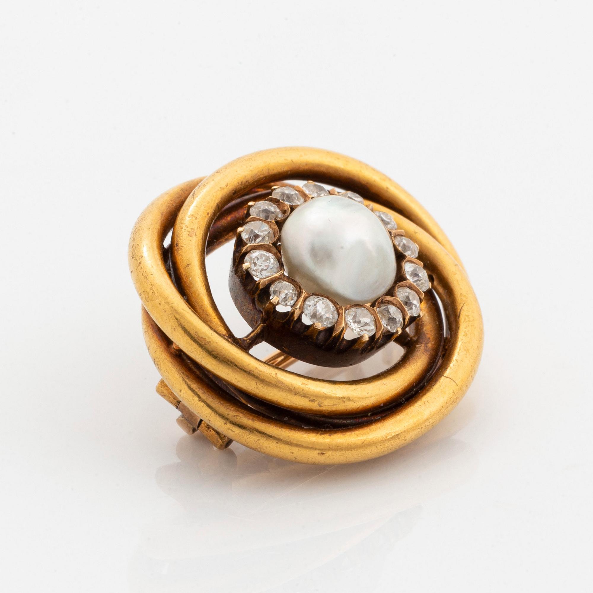 A 14K gold brooch set with a pearl and old-cut diamonds.