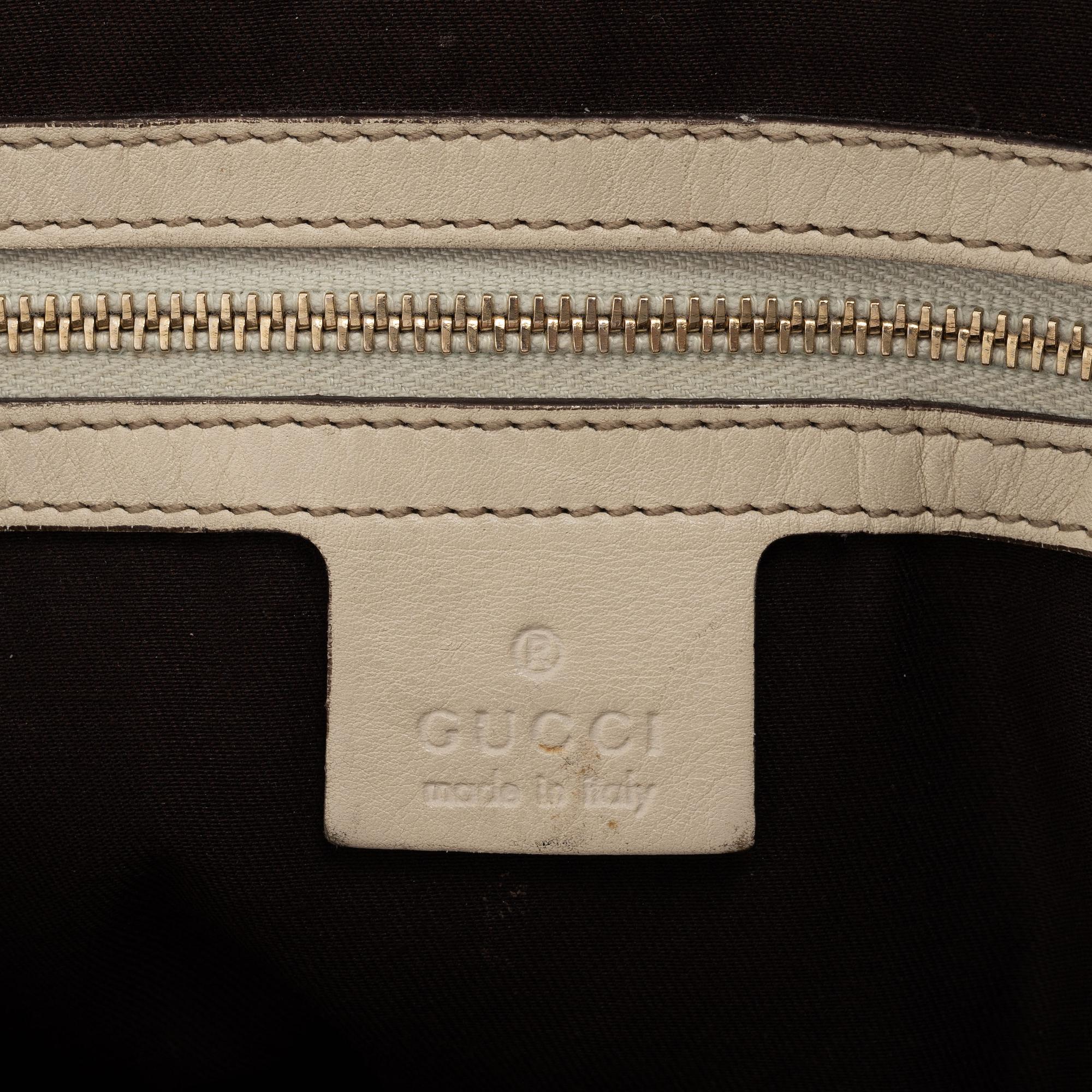Gucci, a cream leather handbag.