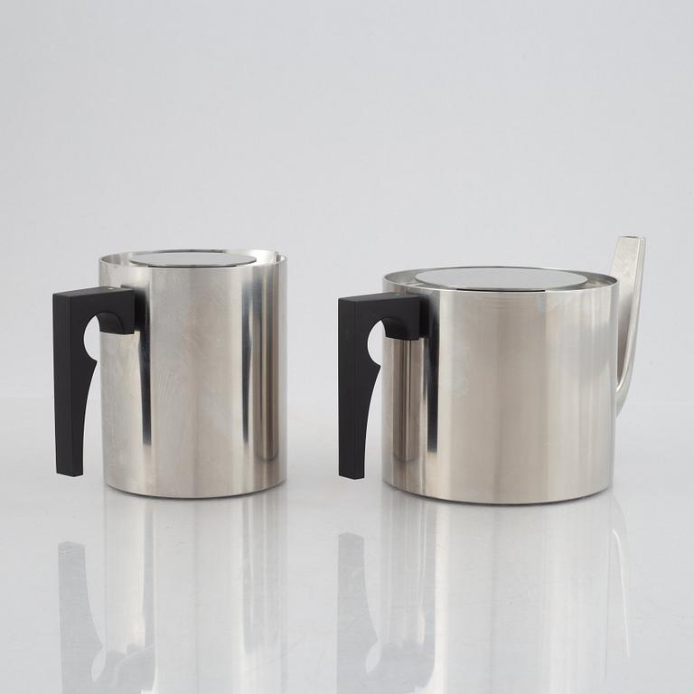 Arne Jacobsen, a 100-year jubilee "Cylinda" stainless steel tea set and a book, Stelton, Denmark, 2002.