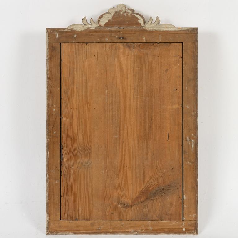 A Gustavian giltwood frame with mirror glass, Stockholm, late 18th century.