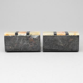 A pair of art déco onyx and marble book ends, 1930s.
