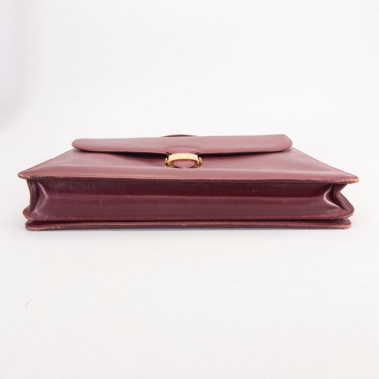 A Cartier leather briefcase.