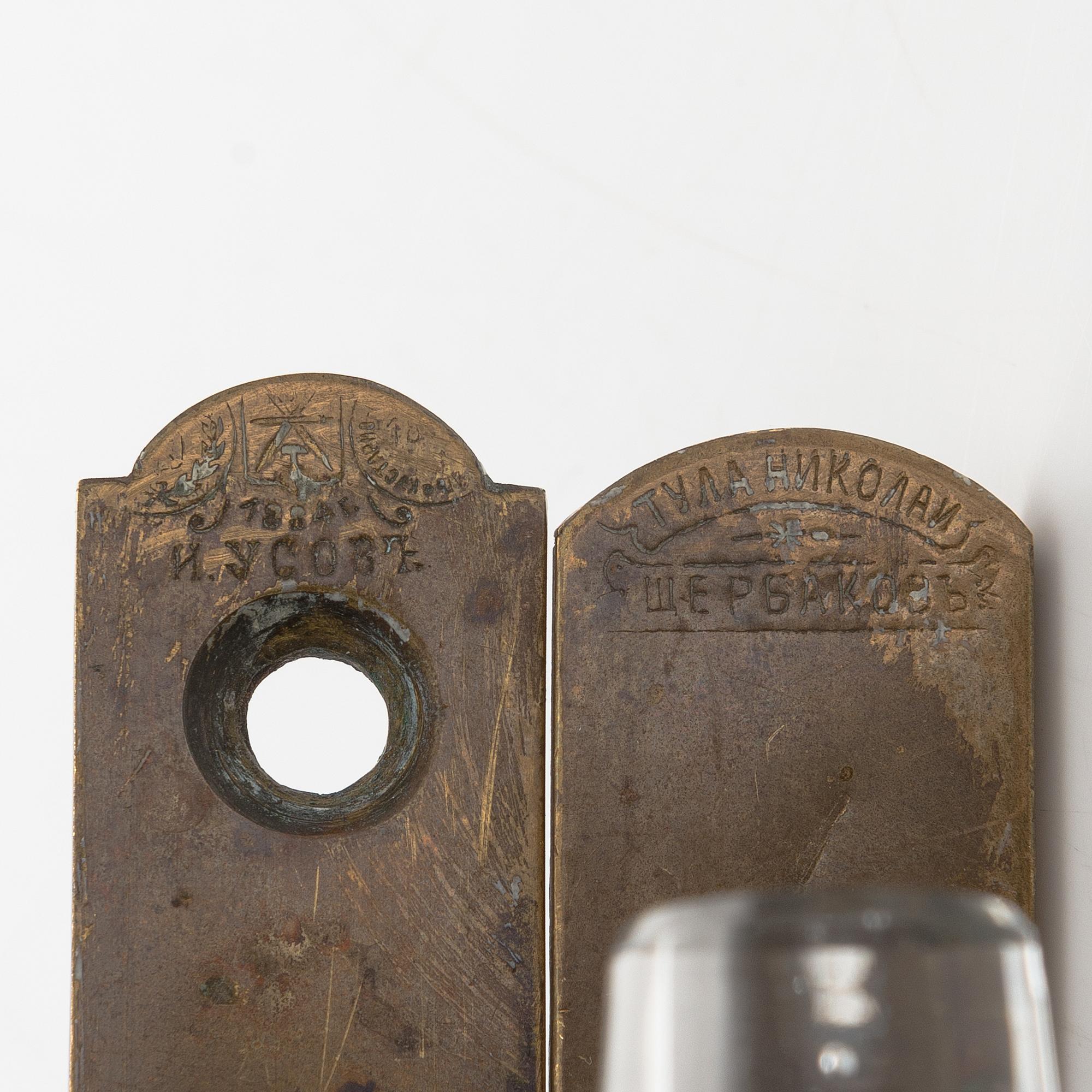Two late 19th-Century glass and brass handles, one from Tula.