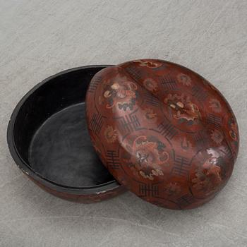 A massive Japanese wooden and lacquered box with cover, in the shape of a peach, early 20th century.