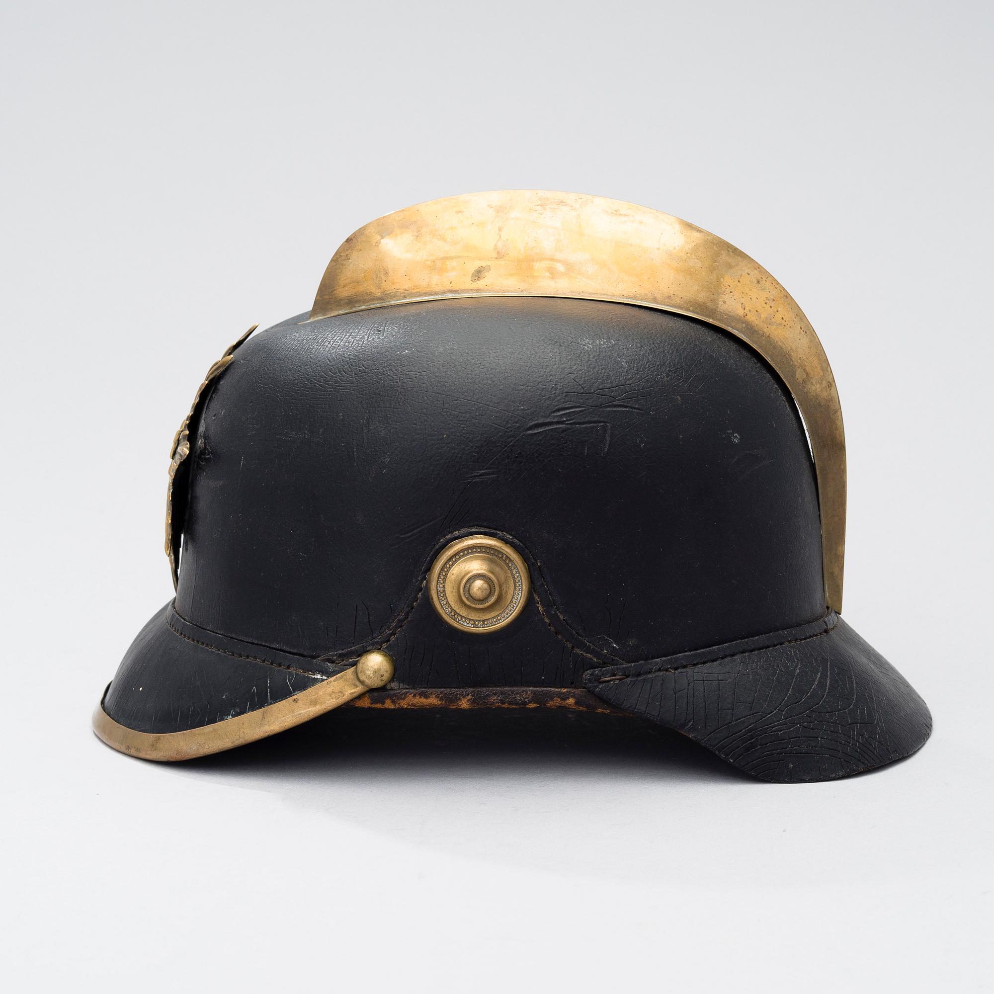 An early 20th century fireman helmet.
