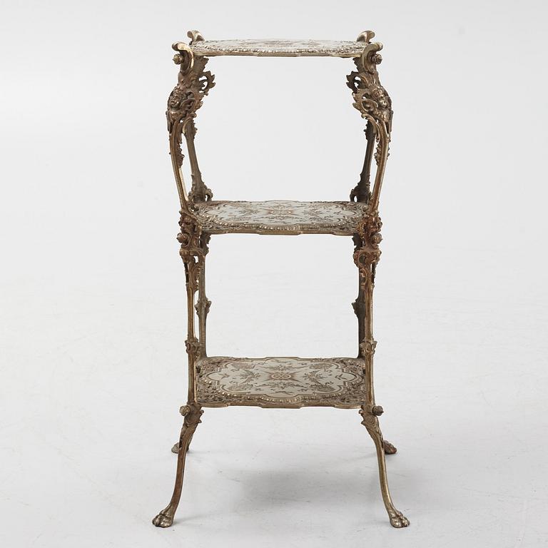 A three-tiered metal pedestal, first half of the 20th century.