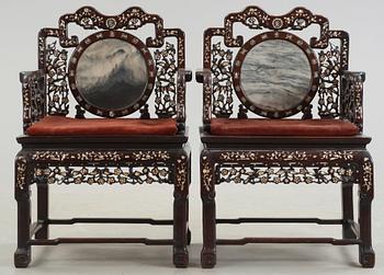 A pair of chinese hardwood and stone armchairs, first half of 20th Century.