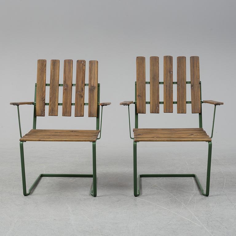 A pair of model A" armchairs from Grythyttan Stålmöbler.