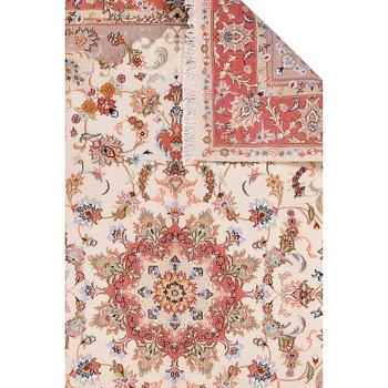 A Kashmar carpet, 295 x 200 cm.