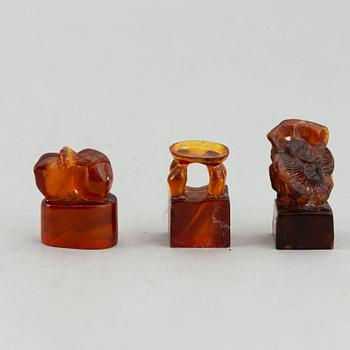 A group of amber objects, China, 20th Century. (14 small pieces).