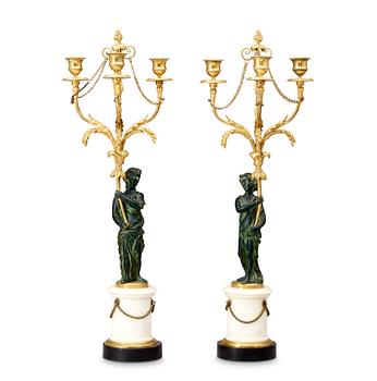 508. A pair of Louis XVI 18th century gilt and patinated bronze and marble three-light candelabra.