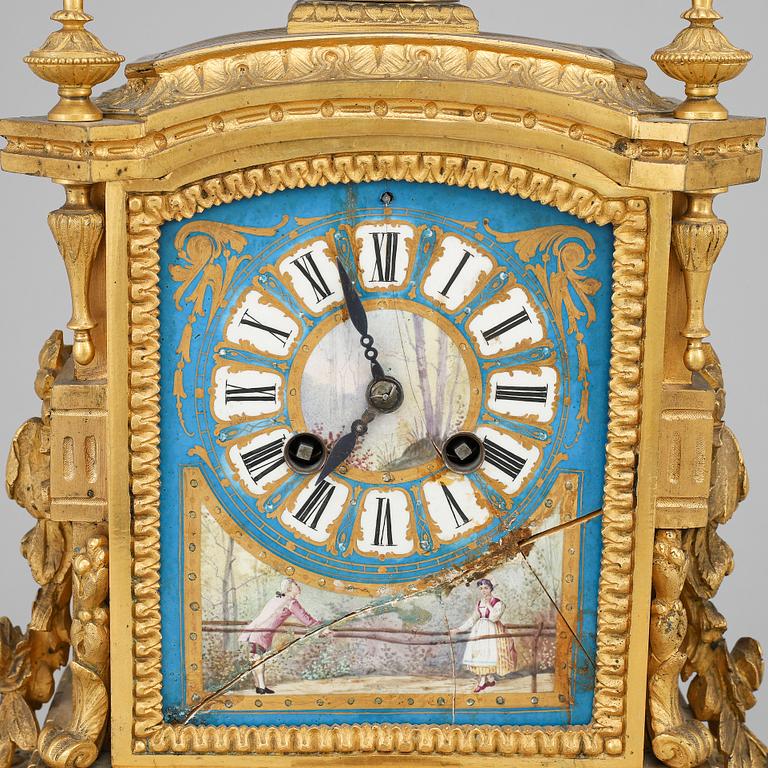 A late 19th Century bronze and porelain mantel clock.