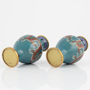 A silk clad box with two cloisonné vases, China early 20th Century.