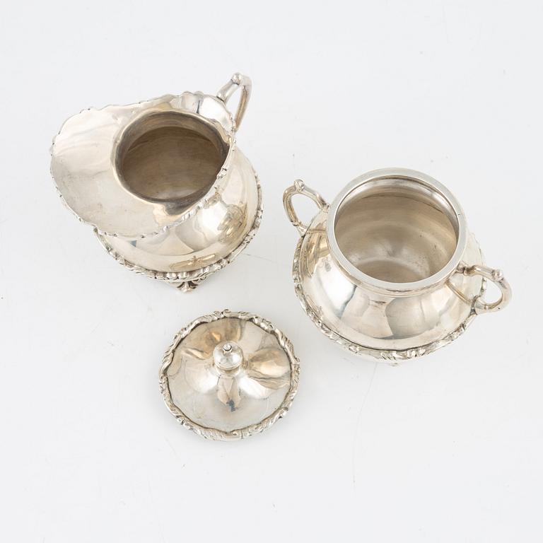 A Mexican Sterling Silver Coffee Pot, Creamer and Sugar Bowl, 20th Century.